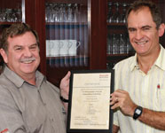 Tectra Automation GM Kevin Lombard (r) and Georg Venter with the certificate of compliance.